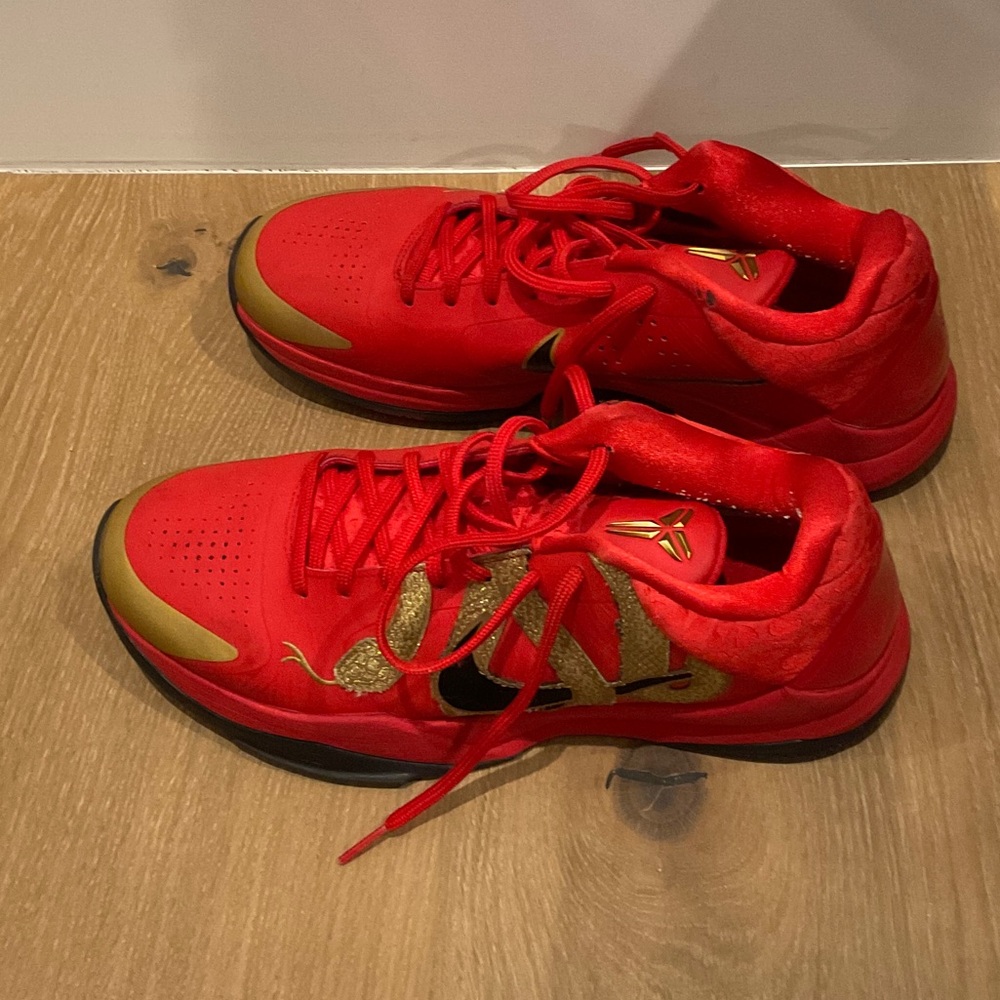 Nike Red Low-Top Kobe Basketball Sneakers with Gold Accents